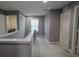 Hallway with neutral paint, showing the laundry room and bedrooms at 3199 Turret Dr, Kissimmee, FL 34743