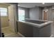 Hallway with neutral color scheme, leading to various rooms at 3199 Turret Dr, Kissimmee, FL 34743