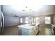 Open-concept kitchen showcases a large island and seamless flow into the living area at 3199 Turret Dr, Kissimmee, FL 34743