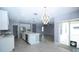 Open layout kitchen leads to dining area and slider doors to the outside at 3199 Turret Dr, Kissimmee, FL 34743