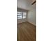 Bedroom featuring wood-look flooring, a ceiling fan, and a bright window at 332 Carolina Ave, St Cloud, FL 34769