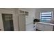 Bright kitchen featuring white appliances, ample cabinet space, and a window over the sink at 332 Carolina Ave, St Cloud, FL 34769