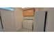 Bright laundry room with a washer, dryer, storage cabinets, and a refrigerator at 332 Carolina Ave, St Cloud, FL 34771