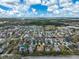 An aerial view of the homes in the community and a local lake at 3329 Schoolhouse Rd, Harmony, FL 34773