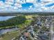Breathtaking aerial view of the community, highlighting lush greenery, serene lakes, and beautiful single-Gathering homes at 3329 Schoolhouse Rd, Harmony, FL 34773
