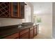 Wet bar with sink and cabinets at 3329 Schoolhouse Rd, Harmony, FL 34773