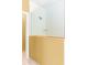 Shower featuring glass, white subway tile, and wooden trim at 3329 Schoolhouse Rd, Harmony, FL 34773
