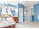 Bathroom featuring dual sinks, nautical décor, and glass enclosed shower at 3329 Schoolhouse Rd, Harmony, FL 34773