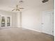 Bedroom featuring neutral paint, a ceiling fan, and french doors to a balcony at 3329 Schoolhouse Rd, Harmony, FL 34773