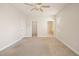 A large, bright bedroom featuring a ceiling fan and multiple doorways at 3329 Schoolhouse Rd, Harmony, FL 34773