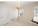 Bright breakfast nook featuring tiled floors, a window, chandelier lighting and access to other areas of the home at 3329 Schoolhouse Rd, Harmony, FL 34773