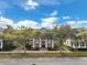 Charming front exterior with a covered porch and mature landscaping at 3329 Schoolhouse Rd, Harmony, FL 34773