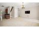Spacious living room featuring tile floors, a wet bar, and an elegant chandelier at 3329 Schoolhouse Rd, Harmony, FL 34773