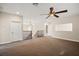 Spacious loft area features staircase, a ceiling fan, neutral paint, and plush carpeting at 3329 Schoolhouse Rd, Harmony, FL 34773