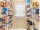 Walk-in pantry with shelving for optimal storage at 3329 Schoolhouse Rd, Harmony, FL 34773