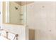 Close up of the tile shower featuring glass door, shower head and shelving at 3329 Schoolhouse Rd, Harmony, FL 34773