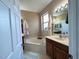 Relaxing bathroom features a large soaking tub, double sinks, and neutral tones at 3491 Allegra Cir, St Cloud, FL 34772