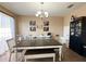 Bright dining room features a chandelier, large table, and stylish furnishings at 3491 Allegra Cir, St Cloud, FL 34772
