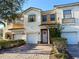 Charming two-story townhouse with brick paved driveway and well-manicured landscaping at 3491 Allegra Cir, St Cloud, FL 34772