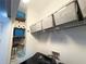 Laundry room featuring custom shelving and storage, maximizing organization and efficiency at 3491 Allegra Cir, St Cloud, FL 34772