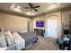 Large main bedroom showcasing a ceiling fan, TV, and a calming color palette at 3491 Allegra Cir, St Cloud, FL 34772