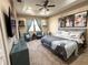 Spacious main bedroom with tray ceiling, large windows, and carpeted floor at 3491 Allegra Cir, St Cloud, FL 34772