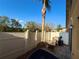 Private fenced patio features a lush palm tree, grill, and patio furniture, ideal for outdoor entertaining at 3491 Allegra Cir, St Cloud, FL 34772