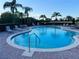 Community pool features lounge seating and calming, clear blue water at 3491 Allegra Cir, St Cloud, FL 34772