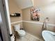 Charming half-bath features a pedestal sink and decorative artwork at 3491 Allegra Cir, St Cloud, FL 34772