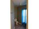 Compact bathroom with a toilet, window with curtains, and tile flooring at 350 Chelmsford Ct, Kissimmee, FL 34758
