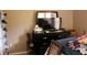 Cozy bedroom with a dresser, TV, and comfortable bed with colorful bedding at 350 Chelmsford Ct, Kissimmee, FL 34758