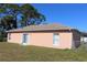 Home exterior showing a sliding glass door with a grassy yard at 350 Chelmsford Ct, Kissimmee, FL 34758