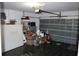 A residential garage with an automatic door and storage shelving, showing the available space at 350 Chelmsford Ct, Kissimmee, FL 34758