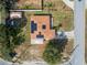 Drone image showing the house, roof with solar panels, driveway and its immediate surroundings at 426 Paradise Island Dr, Haines City, FL 33844