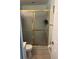 Bathroom with a gold-framed shower, light tile flooring, and neutral walls for a clean aesthetic at 466 Club Dr, Winter Springs, FL 32708