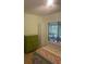 Bedroom features a bed, dresser, and a bright window at 466 Club Dr, Winter Springs, FL 32708