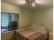 Bedroom features a cozy bed and a bright window at 466 Club Dr, Winter Springs, FL 32708
