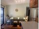 Dining room with wood floors, seating for six, and sliding door to the outside at 466 Club Dr, Winter Springs, FL 32708