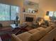 Comfortable living room with a fireplace, plush armchair, and a glass-topped coffee table at 466 Club Dr, Winter Springs, FL 32708
