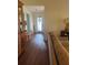 Bright living room with wood floors, a comfortable sofa, and a view into the entry hall at 466 Club Dr, Winter Springs, FL 32708