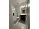 Bathroom showcases a tub-shower combo, modern vanity, stylish lighting, and neutral floor tiles at 4740 Tribute Trl, Kissimmee, FL 34746