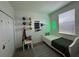Bright bedroom boasts fun soccer decor and neon light fixture, creating a playful atmosphere at 4740 Tribute Trl, Kissimmee, FL 34746