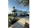 A street view highlighting the well-maintained townhomes, sidewalks, and green spaces within the community at 4740 Tribute Trl, Kissimmee, FL 34746