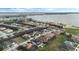 Real estate aerial view of a community near a large lake, showing home exteriors at 4959 Tennessee Lake Dr, Auburndale, FL 33823