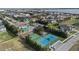 A pool, tennis court, and basketball court are shown in this aerial image of Lake Juliana Estates near a body of water at 4959 Tennessee Lake Dr, Auburndale, FL 33823