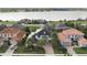 Stunning aerial view of a luxurious home with solar panels and a picturesque lake backdrop at 4959 Tennessee Lake Dr, Auburndale, FL 33823