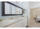 Bathroom featuring double sinks, granite countertops, and framed mirrors at 4959 Tennessee Lake Dr, Auburndale, FL 33823