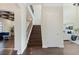 Grand foyer showcasing staircase with wrought iron railing, high ceilings, and hardwood flooring at 4959 Tennessee Lake Dr, Auburndale, FL 33823