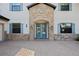 Close up of front door entrance with stone archway and transom windows at 4959 Tennessee Lake Dr, Auburndale, FL 33823