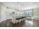 Gourmet kitchen with an eat-in island, stainless steel appliances, and ample cabinet space at 4959 Tennessee Lake Dr, Auburndale, FL 33823